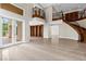 Spacious living room featuring a grand staircase and tons of natural light at 3010 Hammerwood Dr, Las Vegas, NV 89135