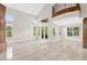 Expansive living room featuring travertine flooring and soaring ceilings at 3010 Hammerwood Dr, Las Vegas, NV 89135