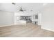 Large open-concept living space featuring a kitchen, bonus room, and tile flooring for easy maintenance at 3010 Hammerwood Dr, Las Vegas, NV 89135