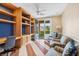 Bright office featuring custom built-ins, a ceiling fan, and access to a private balcony at 3010 Hammerwood Dr, Las Vegas, NV 89135