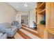 Office or sitting area with hardwood flooring, custom shelving, and comfortable armchairs at 3010 Hammerwood Dr, Las Vegas, NV 89135