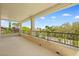 Covered patio with stone columns and iron railing, offering a serene outdoor living space at 3010 Hammerwood Dr, Las Vegas, NV 89135