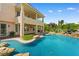Stunning pool featuring rock features, lush plants, and access to the back patio at 3010 Hammerwood Dr, Las Vegas, NV 89135