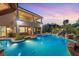 Luxurious swimming pool with landscaped surroundings and a multi-level patio, perfect for relaxation at 3010 Hammerwood Dr, Las Vegas, NV 89135