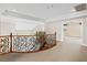 Bright upstairs hallway with wrought iron railing overlooking the floor below at 3010 Hammerwood Dr, Las Vegas, NV 89135