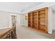 Upstairs hallway with built in bookshelf and curved wrought iron railing at 3010 Hammerwood Dr, Las Vegas, NV 89135