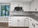 Modern kitchen featuring stainless steel appliances, granite countertops and white cabinets at 3142 Espanol Dr, Las Vegas, NV 89121