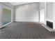 Spacious living room with plush carpeting, neutral walls, and a fireplace, perfect for relaxing and entertaining at 3142 Espanol Dr, Las Vegas, NV 89121