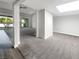 Bright living room featuring neutral paint, carpeted floors, and natural light from sliding glass doors to an outdoor patio at 3142 Espanol Dr, Las Vegas, NV 89121
