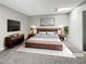 Comfortable primary bedroom with a modern bed, skylight, and a large TV for ultimate relaxation at 3142 Espanol Dr, Las Vegas, NV 89121
