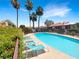 Inviting outdoor pool with lounge chairs and palm trees, offering a relaxing community amenity at 3142 Espanol Dr, Las Vegas, NV 89121
