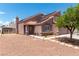 This two-story home features a cozy, enclosed backyard and drought-resistant landscaping at 3547 Empress Diamond Dr, North Las Vegas, NV 89032