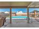 Inviting backyard pool view from covered patio, great for outdoor lounging and entertaining at 3547 Empress Diamond Dr, North Las Vegas, NV 89032