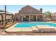 Expansive backyard pool with a charming gazebo and covered patio, perfect for outdoor living at 3547 Empress Diamond Dr, North Las Vegas, NV 89032