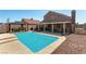 Backyard featuring a refreshing pool, covered patio, and relaxing gazebo, ideal for outdoor living and entertaining at 3547 Empress Diamond Dr, North Las Vegas, NV 89032