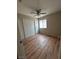 Bedroom featuring wood-look floors, a ceiling fan, and closet at 3729 Bronco Billy Ct, Las Vegas, NV 89129