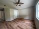 This bedroom boasts wood laminate floors, neutral walls, and a ceiling fan at 3729 Bronco Billy Ct, Las Vegas, NV 89129