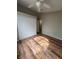 Bedroom featuring wood-look floors, a ceiling fan, and closet at 3729 Bronco Billy Ct, Las Vegas, NV 89129