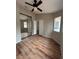 Bedroom features a ceiling fan, wood floors, and closet with mirrored doors at 3729 Bronco Billy Ct, Las Vegas, NV 89129