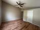 Bedroom featuring laminate floors, neutral walls, and a ceiling fan at 3729 Bronco Billy Ct, Las Vegas, NV 89129