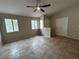 Cozy bedroom with vaulted ceiling, tile floors, and natural light at 3729 Bronco Billy Ct, Las Vegas, NV 89129
