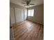 Bedroom featuring wood-look floors, a ceiling fan, and closet at 3729 Bronco Billy Ct, Las Vegas, NV 89129