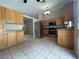 Open kitchen layout with stainless steel appliances and tile flooring at 3729 Bronco Billy Ct, Las Vegas, NV 89129