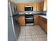 Well-lit kitchen featuring wood cabinets, stainless appliances, and ample countertop space at 3729 Bronco Billy Ct, Las Vegas, NV 89129