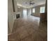 Bright living room with fireplace, tiled floors, and view to the backyard pool at 3729 Bronco Billy Ct, Las Vegas, NV 89129