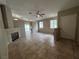 Spacious living room with tiled floors, fireplace, and ample natural light at 3729 Bronco Billy Ct, Las Vegas, NV 89129