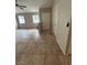 Inviting living room featuring tiled floors, neutral paint, and bright windows at 3729 Bronco Billy Ct, Las Vegas, NV 89129
