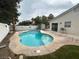 An in-ground kidney-shaped pool in a backyard with green grass at 3729 Bronco Billy Ct, Las Vegas, NV 89129