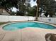 The in-ground kidney-shaped pool is surrounded by concrete and landscaping at 3729 Bronco Billy Ct, Las Vegas, NV 89129