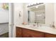 Bathroom featuring a vanity with a sink, a mirror with lighting, and an adjacent walk-in shower at 3982 Voxna St, Las Vegas, NV 89119
