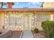 Charming home featuring stone accents, an enclosed entryway, and a security screen door at 3982 Voxna St, Las Vegas, NV 89119