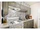 Efficient kitchen featuring grey cabinets, neutral countertop, and gas range stove at 3982 Voxna St, Las Vegas, NV 89119
