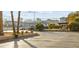 Apartment complex featuring a parking area and palm trees along a street at 3982 Voxna St, Las Vegas, NV 89119
