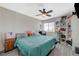 Cozy bedroom with ceiling fan, window, and shelving unit at 4 Tarryall Ter, Henderson, NV 89074