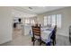 Dining room area with wood floors, a dining table set for six and lots of natural light at 4 Tarryall Ter, Henderson, NV 89074