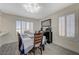 Dining room area featuring hardwood floors, shutters on the windows, and overhead lighting at 4 Tarryall Ter, Henderson, NV 89074