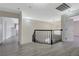 Well-lit upstairs hallway with wood floors, overhead lighting, and doors leading to bedrooms at 4 Tarryall Ter, Henderson, NV 89074