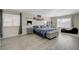 Spacious main bedroom with wood floors, a large window with a view and lots of natural light at 4 Tarryall Ter, Henderson, NV 89074