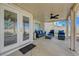 Covered patio featuring a cozy seating area and outdoor fan at 4 Tarryall Ter, Henderson, NV 89074
