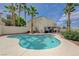 Beautiful backyard pool surrounded by lush landscaping and towering palm trees, perfect for relaxation at 4 Tarryall Ter, Henderson, NV 89074