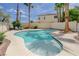 Inviting backyard pool with sunbathing deck and desert landscaping, surrounded by privacy walls and mature trees at 4 Tarryall Ter, Henderson, NV 89074