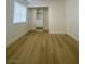 Bedroom with natural light, closet, fresh paint, and wood vinyl flooring at 4248 Tara Ave # 2, Las Vegas, NV 89102