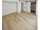 Open bedroom with wood vinyl flooring, slider barn door, and access to the closet at 4248 Tara Ave # 2, Las Vegas, NV 89102