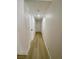 Hallway with freshly painted white walls and light wood vinyl flooring at 4248 Tara Ave # 2, Las Vegas, NV 89102