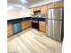 Well-equipped kitchen with stainless steel appliances and maple wood cabinets at 4248 Tara Ave # 2, Las Vegas, NV 89102