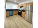 Modern kitchen features stainless steel appliances and wood cabinetry at 4248 Tara Ave # 2, Las Vegas, NV 89102
